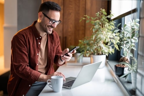 Satisfiedmodernmillennialmaninstylishcasualclothesusingsmartphone Payoutscom Satisfiedmodernmillennialmaninstylishcasualclothesusingsmartphone
